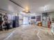 Spacious garage with appliances, workout area, and door to outside at 10948 Murray Dr, Northglenn, CO 80233