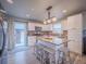 Updated kitchen featuring a central island and stainless steel appliances at 10948 Murray Dr, Northglenn, CO 80233