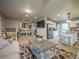 Open-concept living room with kitchen access at 10948 Murray Dr, Northglenn, CO 80233