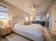 Bright bedroom with natural light featuring neutral walls, woven shades, and a comfortable bed at 10948 Murray Dr, Northglenn, CO 80233