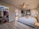 Spacious bedroom with an ensuite closet and a ceiling fan above the bed at 10948 Murray Dr, Northglenn, CO 80233