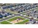 Aerial view of a Primary-planned community with solar panels, green spaces, and well-maintained streets at 723 176Th Ave, Broomfield, CO 80023