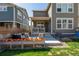 Backyard featuring a stone patio, a grassy area, a privacy fence, and a covered patio at 723 176Th Ave, Broomfield, CO 80023