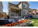 Lovely backyard featuring a patio, seating area, and well-maintained lawn at 723 176Th Ave, Broomfield, CO 80023