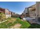 Lush backyard featuring a patio seating area, green grass and a privacy fence perfect for relaxing outdoors at 723 176Th Ave, Broomfield, CO 80023
