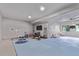 Partially finished basement offering ample space with a TV and workout equipment at 723 176Th Ave, Broomfield, CO 80023