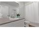 Clean bathroom featuring a single vanity with a white countertop, large mirror, and white shower curtain at 723 176Th Ave, Broomfield, CO 80023