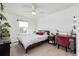 Bright bedroom with cozy bed and desk area filled with live plants at 723 176Th Ave, Broomfield, CO 80023