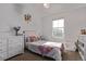 Cozy bedroom with a plush bed, floral accents, and a bright window at 723 176Th Ave, Broomfield, CO 80023