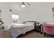 Bedroom with a window, ceiling fan, bed, and desk area at 723 176Th Ave, Broomfield, CO 80023