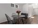 Cozy dining area featuring a round table, stylish chairs, and abundant natural light; ideal for intimate gatherings at 723 176Th Ave, Broomfield, CO 80023
