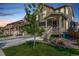 Inviting home exterior with a covered porch, landscaped front yard, and a well-maintained lawn in a desirable neighborhood at 723 176Th Ave, Broomfield, CO 80023