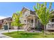 Charming exterior view of a two-story home with well-maintained lawn and landscaping at 723 176Th Ave, Broomfield, CO 80023