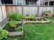 Charming backyard garden with raised beds and a variety of plants, creating a serene and green space at 723 176Th Ave, Broomfield, CO 80023