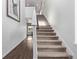 Hallway with hardwood floors and carpeted staircase leading to the second floor at 723 176Th Ave, Broomfield, CO 80023