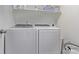 A well-organized laundry area equipped with a washer and dryer at 723 176Th Ave, Broomfield, CO 80023