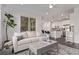 Open concept living space featuring hardwood floors, a comfortable sofa, and seamless access to the kitchen at 723 176Th Ave, Broomfield, CO 80023