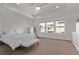 Bright main bedroom featuring tray ceilings, a ceiling fan, and three windows offering lots of natural light at 723 176Th Ave, Broomfield, CO 80023