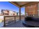 Cozy covered patio with stylish outdoor seating and views of the backyard and surrounding neighborhood at 723 176Th Ave, Broomfield, CO 80023