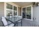 Covered patio with a glass table and comfortable seating, perfect for outdoor dining and relaxation at 723 176Th Ave, Broomfield, CO 80023
