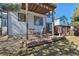 A ground-level deck provides a cozy outdoor dining area, complemented by views of the backyard at 8588 Sweet Clover Way, Parker, CO 80134