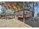 Multi-level wooden deck in a sunny backyard provides great outdoor space for entertainment and enjoying nature at 8588 Sweet Clover Way, Parker, CO 80134