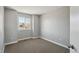 Simple bedroom offering a calming retreat with plush carpet, a window, and ample natural light at 8588 Sweet Clover Way, Parker, CO 80134