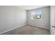 Simple bedroom offering a calming retreat with plush carpet, a window, and ample natural light at 8588 Sweet Clover Way, Parker, CO 80134