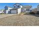 Charming two-story home with a two-car garage, inviting porch, and classic black and white trim at 8588 Sweet Clover Way, Parker, CO 80134