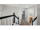 Upstairs hallway featuring neutral paint, carpeted floor, and doors leading to bedrooms and bathrooms at 8588 Sweet Clover Way, Parker, CO 80134