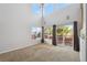 Bright living room with vaulted ceilings, large windows, and sliding glass doors to the deck at 8588 Sweet Clover Way, Parker, CO 80134