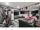 Finished basement with a workout area, large TV, and a comfortable lounging space at 15800 E 121St Ave # 4K, Brighton, CO 80603