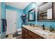 Bright bathroom offers a large double vanity, granite counters, updated hardware, and tile floors at 15800 E 121St Ave # 4K, Brighton, CO 80603