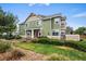 Charming two-story home with green siding and a well-manicured lawn at 15800 E 121St Ave # 4K, Brighton, CO 80603