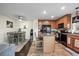 Charming kitchen features an island, black appliances, and a cozy dining area with lots of natural light at 15800 E 121St Ave # 4K, Brighton, CO 80603