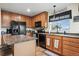 Efficient kitchen with island seating and modern appliances at 15800 E 121St Ave # 4K, Brighton, CO 80603