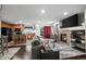 Open-concept living room flows into the kitchen and dining area at 15800 E 121St Ave # 4K, Brighton, CO 80603