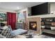 Cozy living room featuring a fireplace, dark hardwood floors, and plenty of natural light at 15800 E 121St Ave # 4K, Brighton, CO 80603