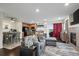Open-concept living room flows into the kitchen and dining area at 15800 E 121St Ave # 4K, Brighton, CO 80603