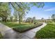 Community playground featuring various play structures surrounded by lush greenery and trees at 15800 E 121St Ave # 4K, Brighton, CO 80603