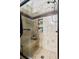 Deluxe shower with tile surround, a built-in bench, river stone flooring, and dual shampoo niches at 15800 E 121St Ave # 4K, Brighton, CO 80603