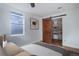 Bedroom with walk-in closet and sliding barn door at 35 S Washington St # 1-2, Denver, CO 80209