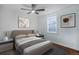 Bedroom with hardwood floors and ceiling fan at 35 S Washington St # 1-2, Denver, CO 80209