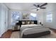 Bright bedroom with hardwood floors and ceiling fan at 35 S Washington St # 1-2, Denver, CO 80209