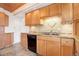 Updated kitchen features wood cabinets and granite countertops at 35 S Washington St # 1-2, Denver, CO 80209