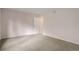 Bedroom features neutral carpeting and a white door at 4605 S Yosemite St # 301, Denver, CO 80237