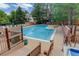 A refreshing community pool with lounge chairs and a wooden deck at 4605 S Yosemite St # 301, Denver, CO 80237