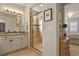 Bathroom showcasing a glass-enclosed shower, vanity with granite countertop and a tiled floor at 10828 Valleybrook Cir, Highlands Ranch, CO 80130