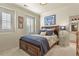 Bedroom with wood furniture, decorative pillows, and an en-suite bathroom at 10828 Valleybrook Cir, Highlands Ranch, CO 80130