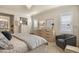 Bright bedroom with natural light, neutral tones, and a relaxing sitting area at 10828 Valleybrook Cir, Highlands Ranch, CO 80130